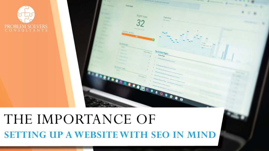 A laptop screen showcases website analytics, with the banner reading "The Importance of Setting Up a Small Business Website with SEO in Mind.